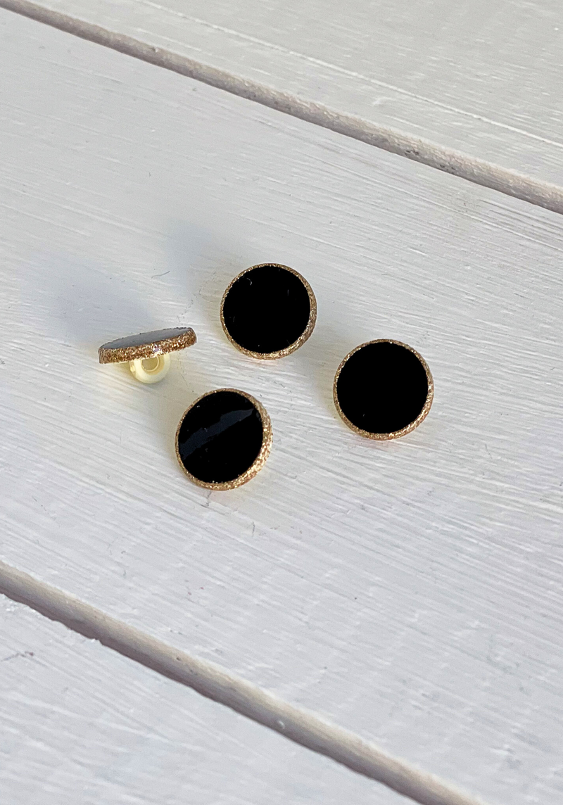 Bouton Dot Noir à paillettes dorées